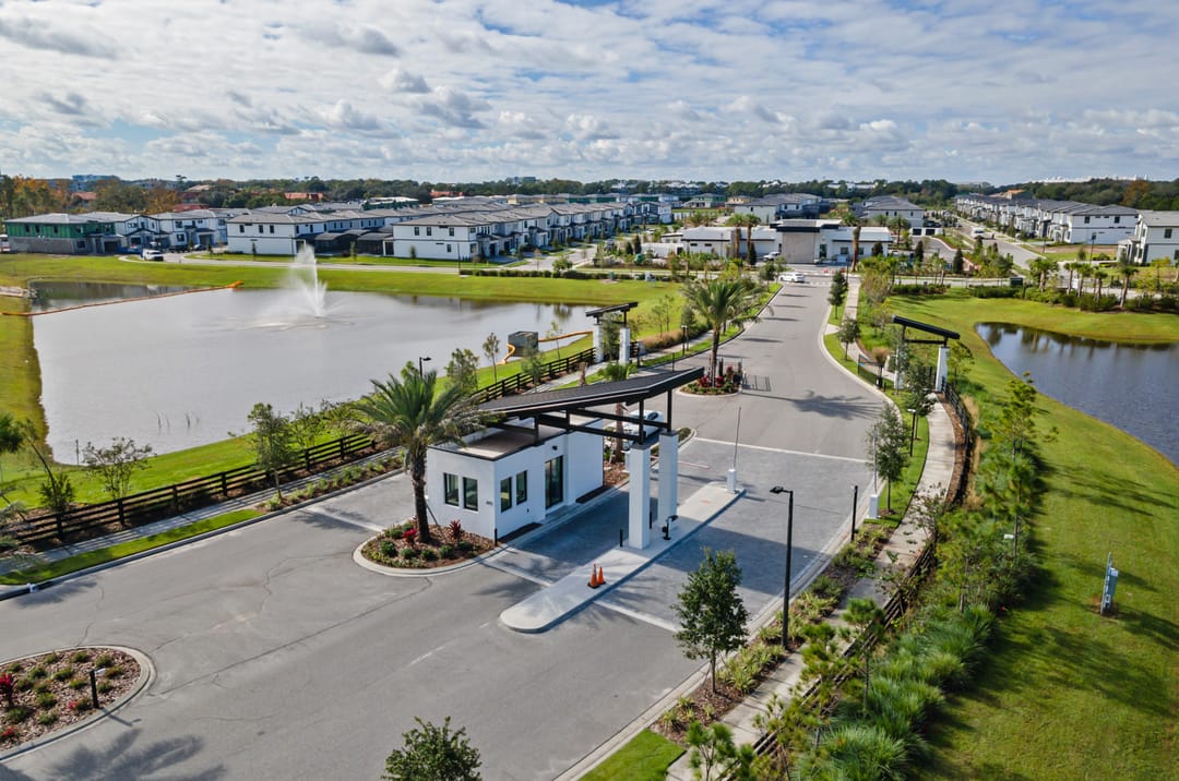 Paradiso Grande Resort — Community entrance with guardhouse and fountain