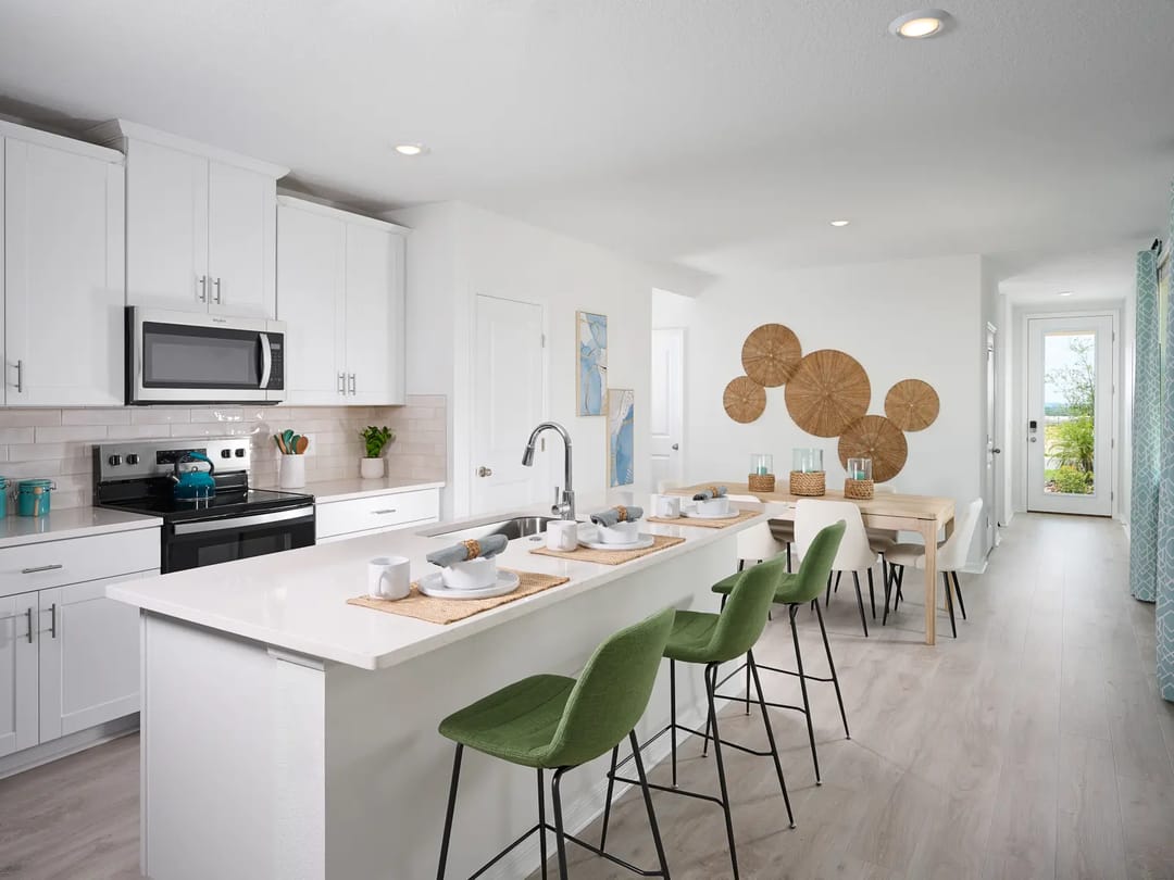 Hamilton Bluff — Kitchen and dining room in the Everglade floorplan modeled at Hamilton Bluff