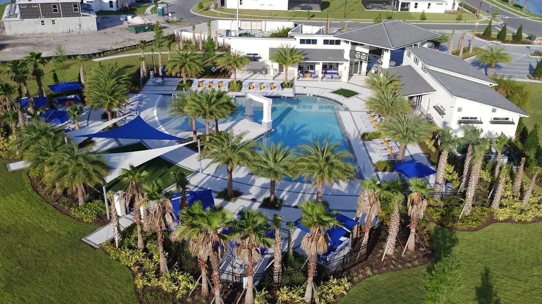 Elevated at Sonoma Resort — Aerial view of the community pool with shade sails