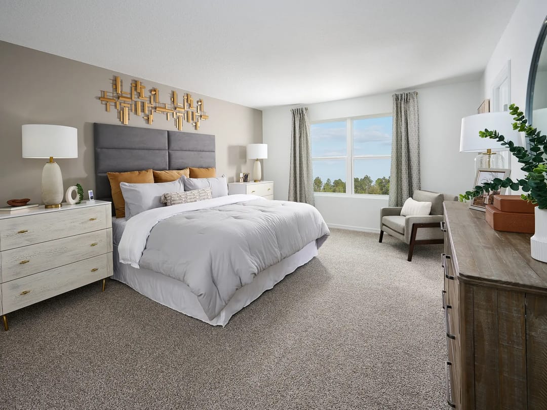 Bradbury Creek — Primary bedroom in the Zion floorplan modeled at Bradbury Creek