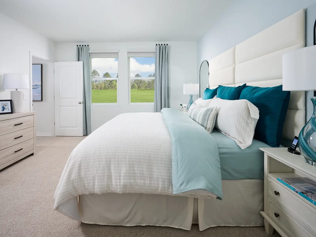 Hamilton Bluff — Primary bedroom in the Everglade floorplan modeled at Hamilton Bluff
