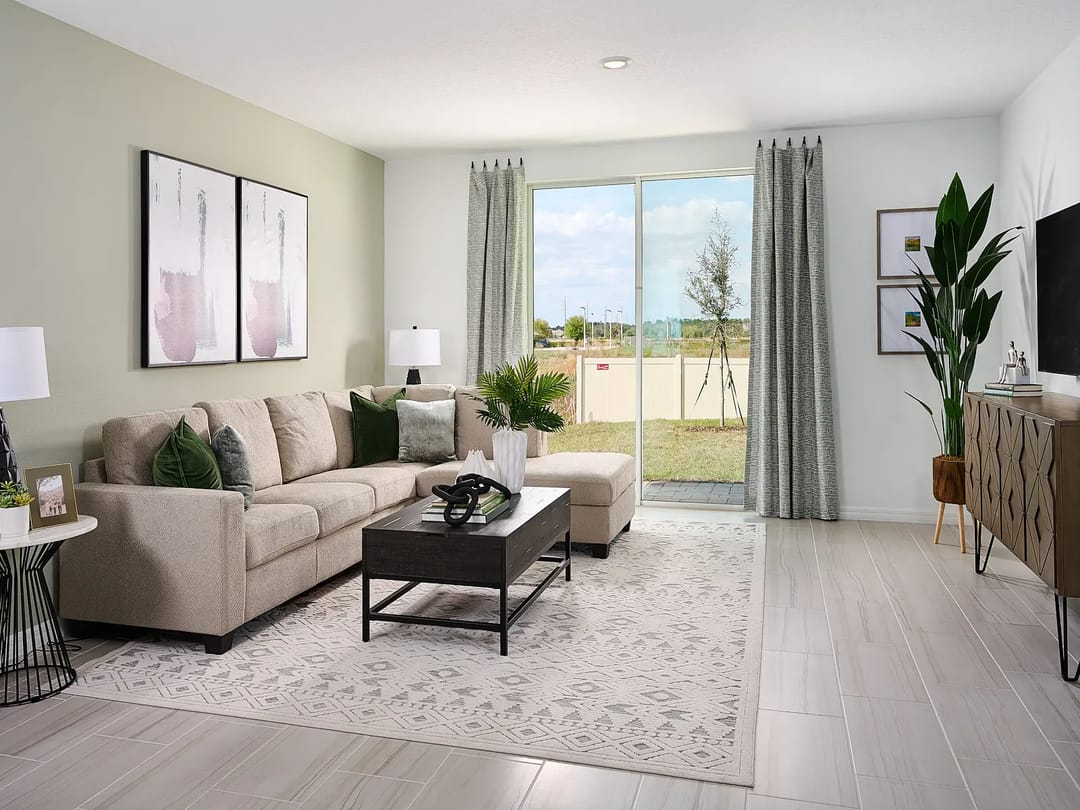 Lake Deer Estates — Family room in Acadia floorplan modeled at Lake Deer Estates