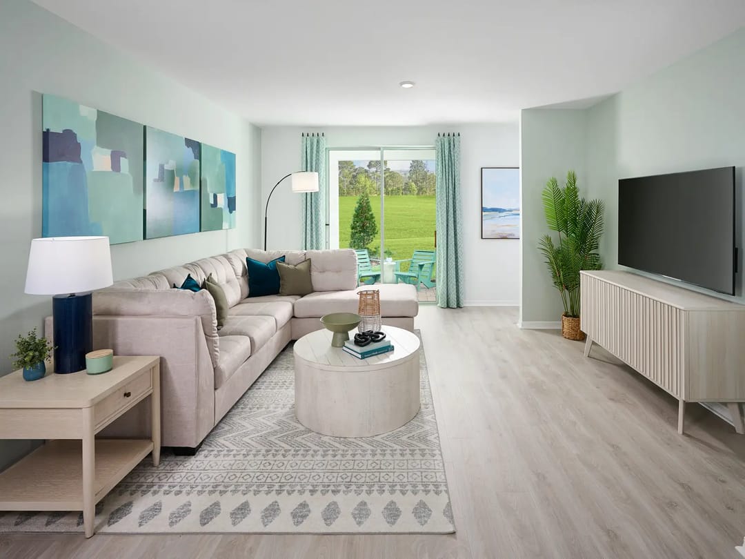 Hamilton Bluff — Living room in the Everglade floorplan modeled at Hamilton Bluff
