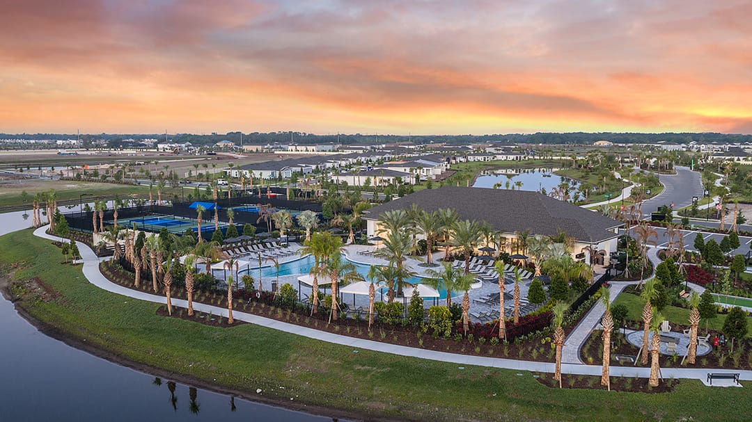 Esplanade at Center Lake Ranch — The Venue and resort pool at dusk